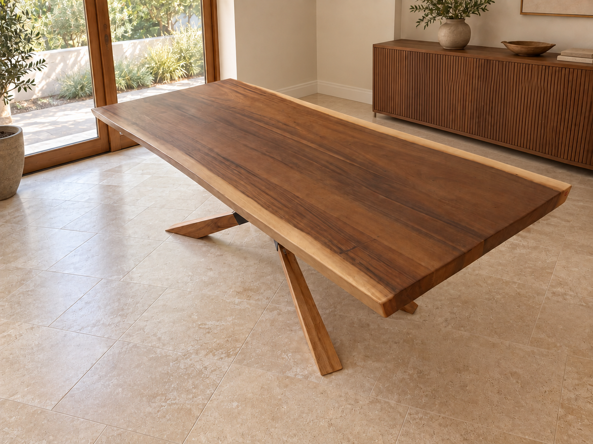 Natural monkeypod table with the optional Monkeypod spider-leg upgrade, shown alone in a digitally staged room