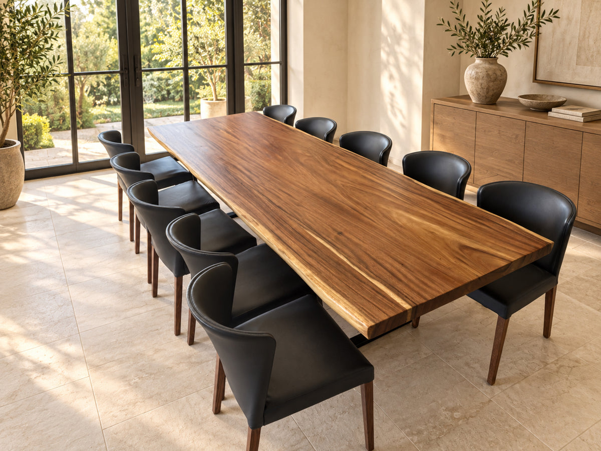 Natural live edge dining table with ten black chairs in a digitally staged sunlit room